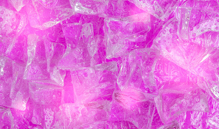 Ice cube on color background with droplet. Concept background for summer.の写真素材