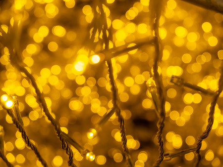 Beautiful blurred yellow light bokeh for celebrations backgroundの写真素材
