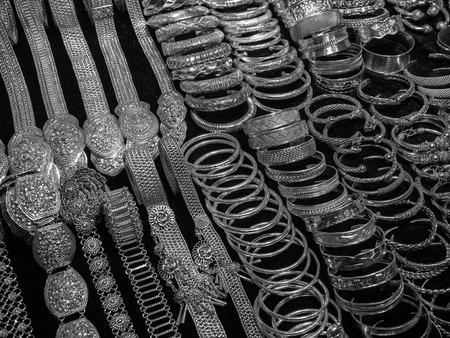 Beautiful variety of silver jewelry for women on market of Thailand : bangles, belts and more.の写真素材