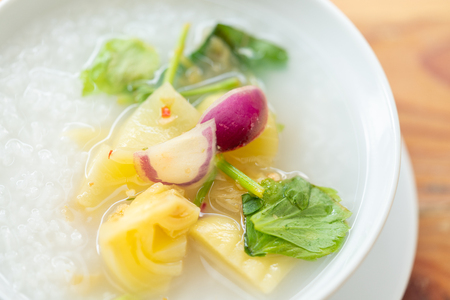 Close up delicious pickled cabbage mixed with purple onion, chilli and celery over rice soup.の写真素材