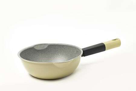 Side view a modern fry pan, skillet, isolated on white backgroundの写真素材