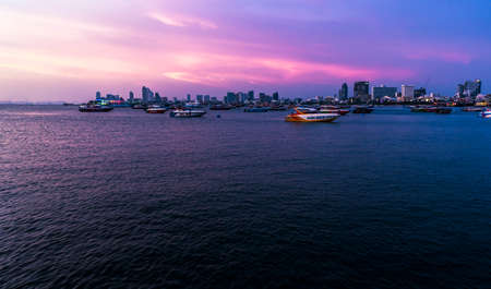 Pattaya, Thailand: May 19, 2019 Late Sunset, Many speed boats in Pattaya Bay area. Wide angle scenery of sea scape, twilight sky with colors. The water with reflections and space for the letters.のeditorial素材