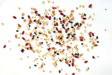 Isolated varieties of beans spread on white background, top view beautiful spread of organic mix...