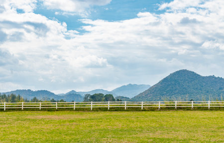Landscape empty farm with background of mountain scape and cloudy sky. Wide angle view, day light...