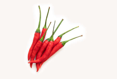 Top view pile of red chili or Jinda Chili in Thai language, close up image on white background.の写真素材