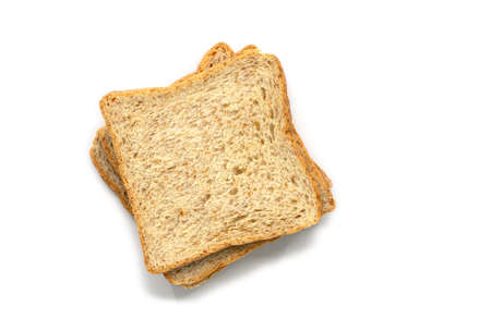 Sliced whole wheat bread on white background, flat lay image of stack whole wheat bread, top view...