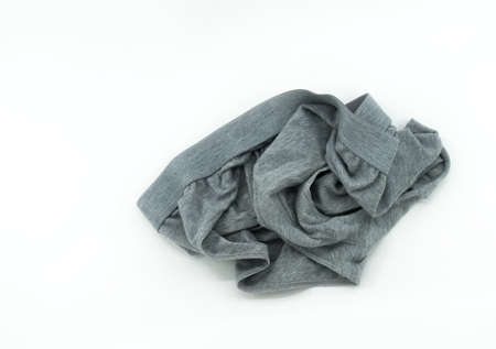 Isolated men's underwear on white background, throw away used underwear on the floor, top view image used men's underwear, gray color.の写真素材