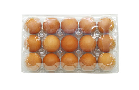 Pack of 15 chicken eggs, isolated clear plastic packaging of fifteen brown chicken eggs on a white...
