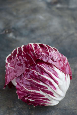 Radicchio red salad on dark wooden backgroundの写真素材