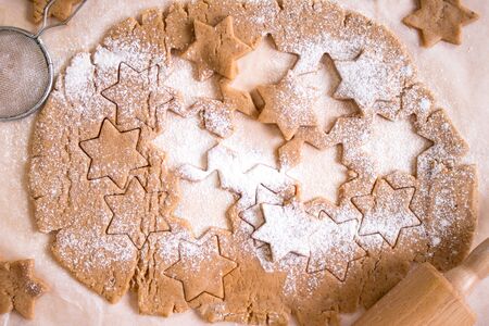 Cutting gingerbread cookies. Process of baking cookies at home