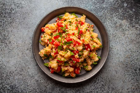 Middle eastern and Mediterranean traditional vegetable salad tabbouleh, from above. Arab snack or appetizer, light and healthy food, top view .の写真素材