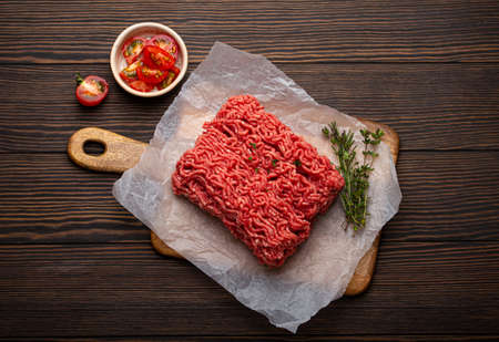 Raw minced meat with cooking ingredients from aboveの写真素材