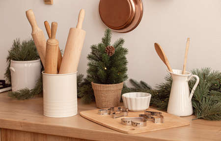 Festive christmas kitchen table with baking toolsの写真素材