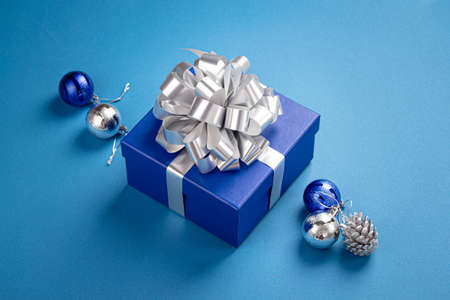 Christmas composition with present and decorations in blue and silver colorsの写真素材