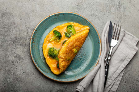 Healthy omelette with broccoli on plate top viewの写真素材