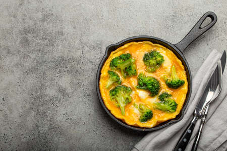 Healthy omelette with broccoli in cast iron pan top view copy spaceの写真素材