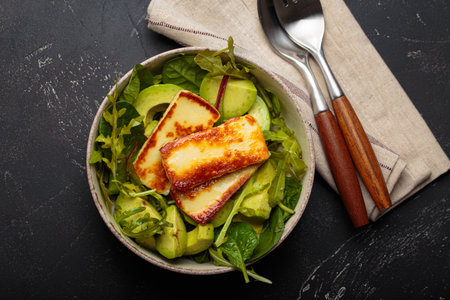 Halloumi avocado salad greens bowl healthy vegetarian diet nutrition top viewの写真素材