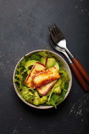 Halloumi avocado salad greens bowl healthy vegetarian diet nutrition top viewの写真素材