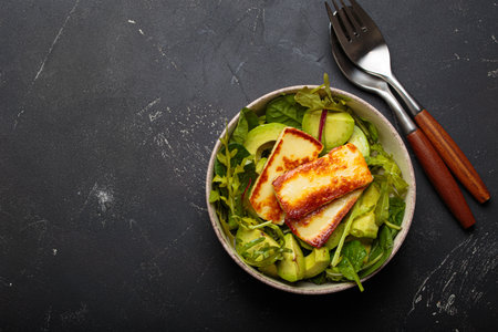 Halloumi avocado salad greens bowl healthy vegetarian diet nutrition copy spaceの写真素材