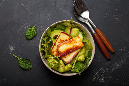 Halloumi avocado salad greens bowl healthy vegetarian diet nutrition top viewの写真素材