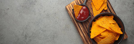 Nachos tortilla chips salsa dip wooden board Mexican Tex-Mex snack fast food copy space