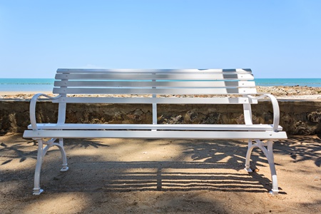 white long chair for relaxing on the sea backgroundの写真素材