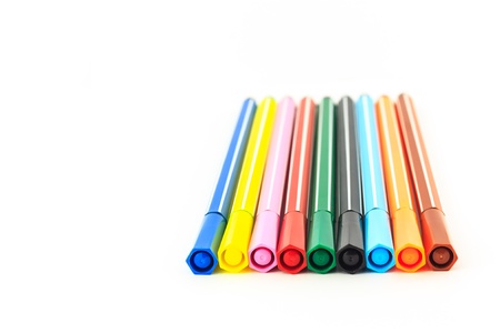 group of the colorful pen in holder isolated on white backgroundの写真素材