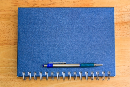 the note book on the table backgroundの写真素材