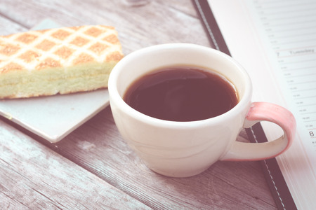 coffee cup on table with cake : vintage styleの写真素材
