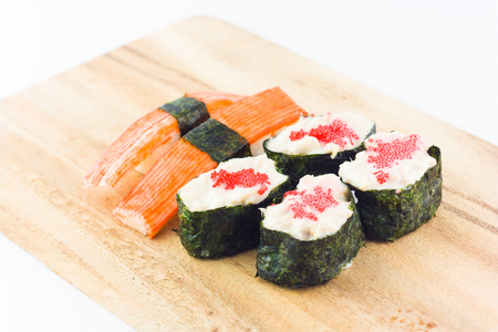sushi in wooden plate on white backgroundの写真素材