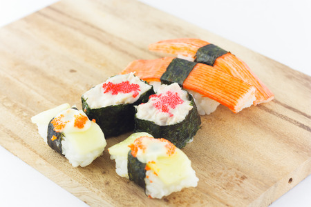 sushi in wooden plate on white backgroundの写真素材