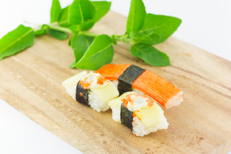 sushi in wooden plate on white backgroundの写真素材