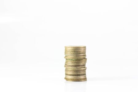 column of coins isolated on white backgroundの写真素材