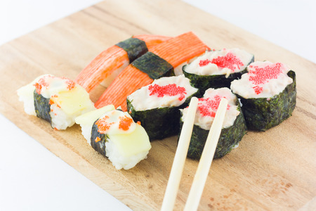 sushi in wooden plate on white backgroundの写真素材