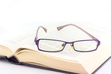 book and glasses on white backgroundの写真素材