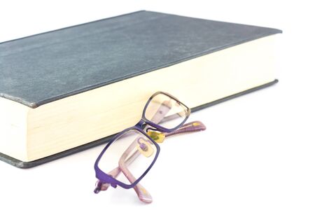 book and glasses on white backgroundの写真素材