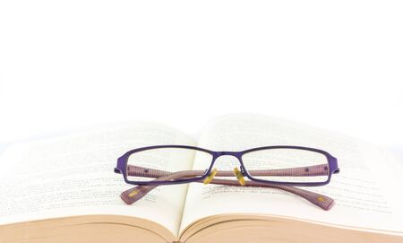 book and glasses on white backgroundの写真素材