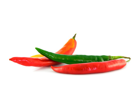 red and green chili on white backgroundの写真素材