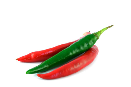red and green chili on white backgroundの写真素材