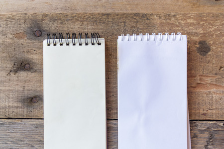 paper note on old wood background