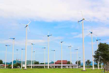 windmill in green field with blue skyの写真素材