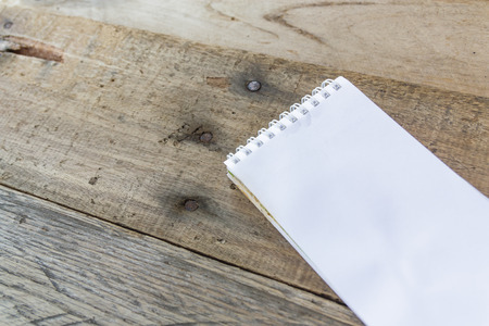 paper note on old wood background