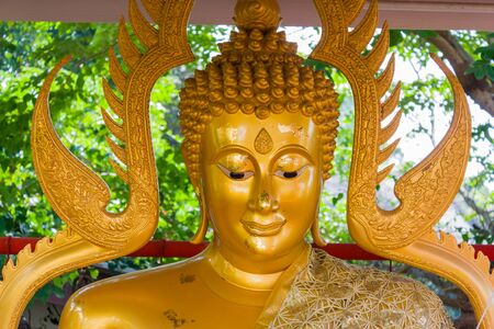 close up on face of buddha image in the public templeの写真素材