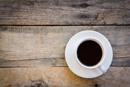 top view cup of coffee on wood table background