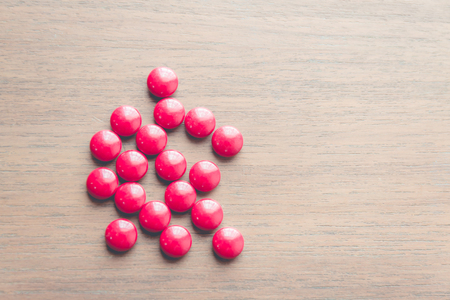 medicine pill on wood tableの写真素材