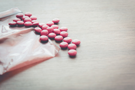 medicine pill on wood tableの写真素材