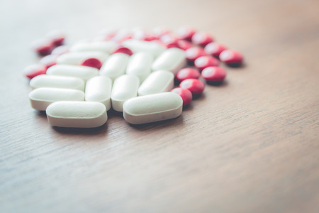 medicine pill on wood tableの写真素材