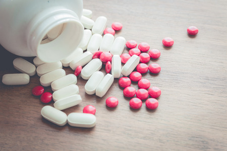 medicine pill on wood tableの写真素材