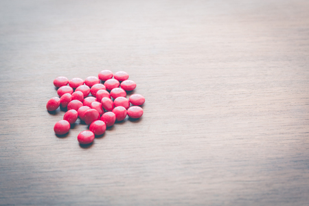 medicine pill on wood tableの写真素材