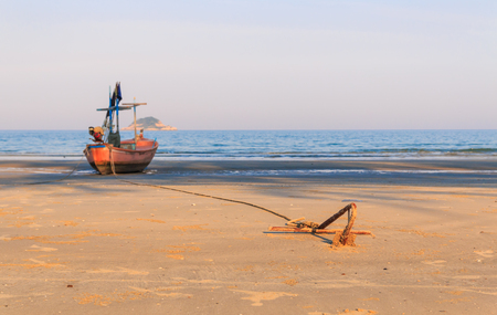 fishing boat waiting on the beach for high tide : Hua Hin  Thailandの写真素材